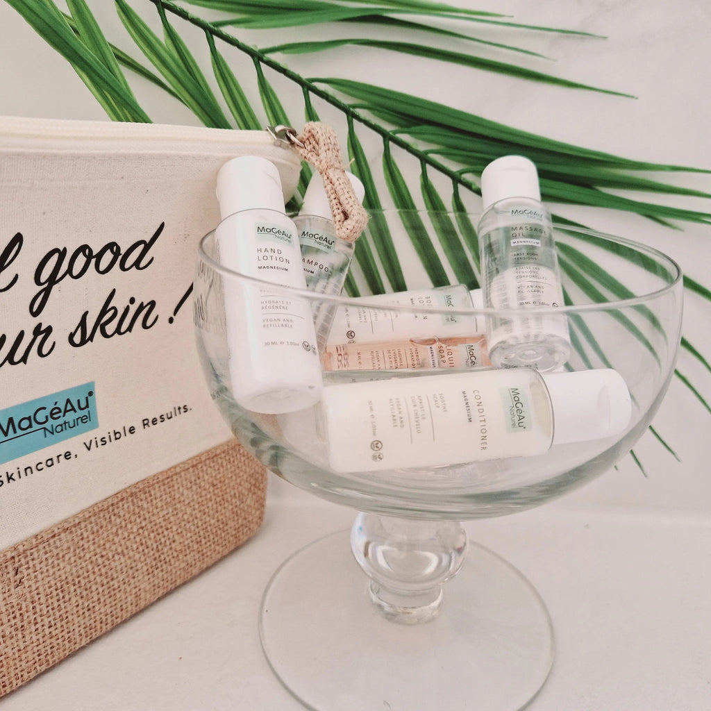Skincare products on a glass dish with a branded bag in the background