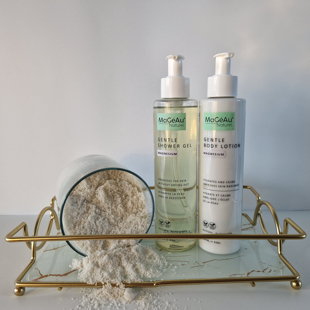 Two bottles of Mageau naturel magnesium  skincare products on a gold tray with a white background