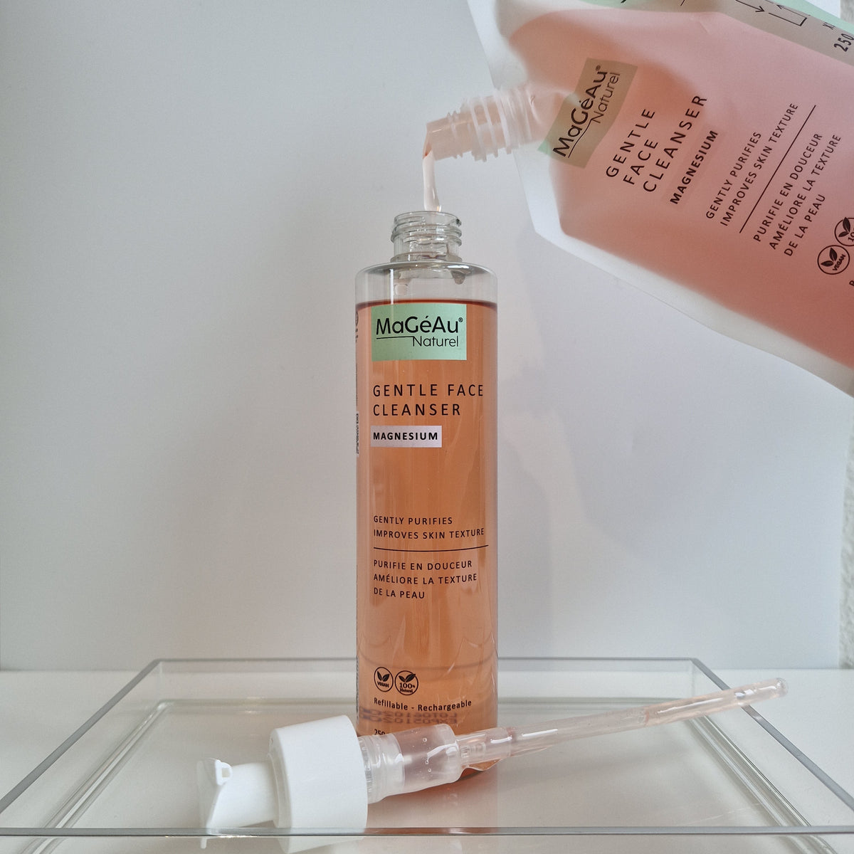 MaGéAu Naturel Gentle Face Cleanser bottle being filled with a pump, with a white background.